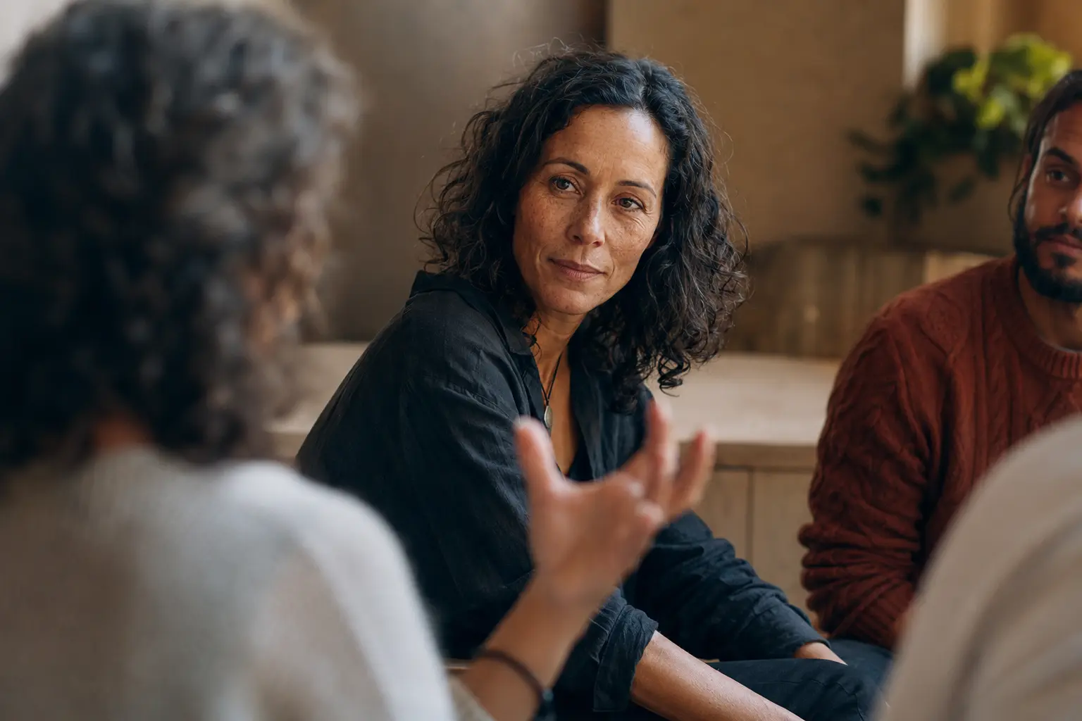 A participant listening in the circle